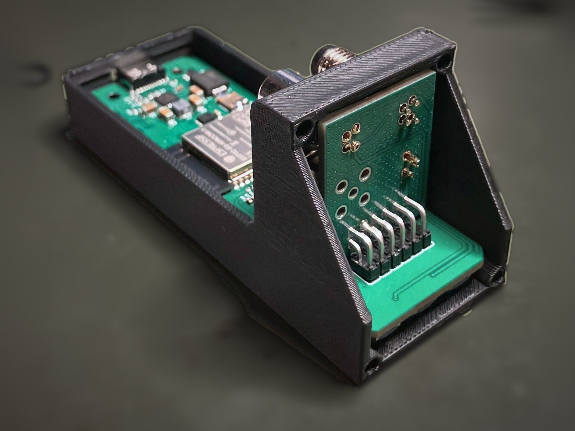Open Agile v1.0 enclosure with the display board standing in its angled mount above the main board