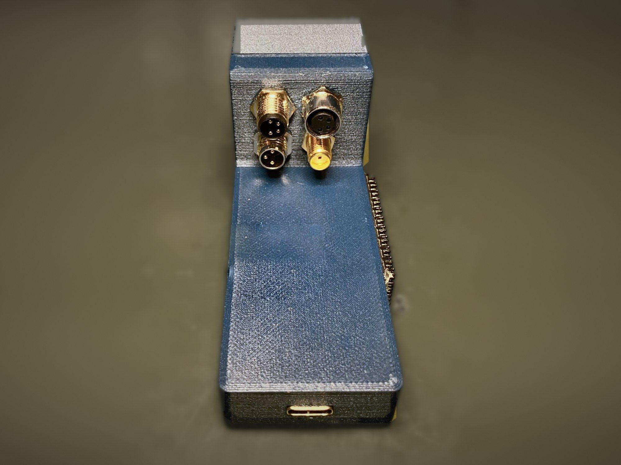 Agile v1.0 seen from behind, with the connector panel at the top and the USB-C port at the bottom